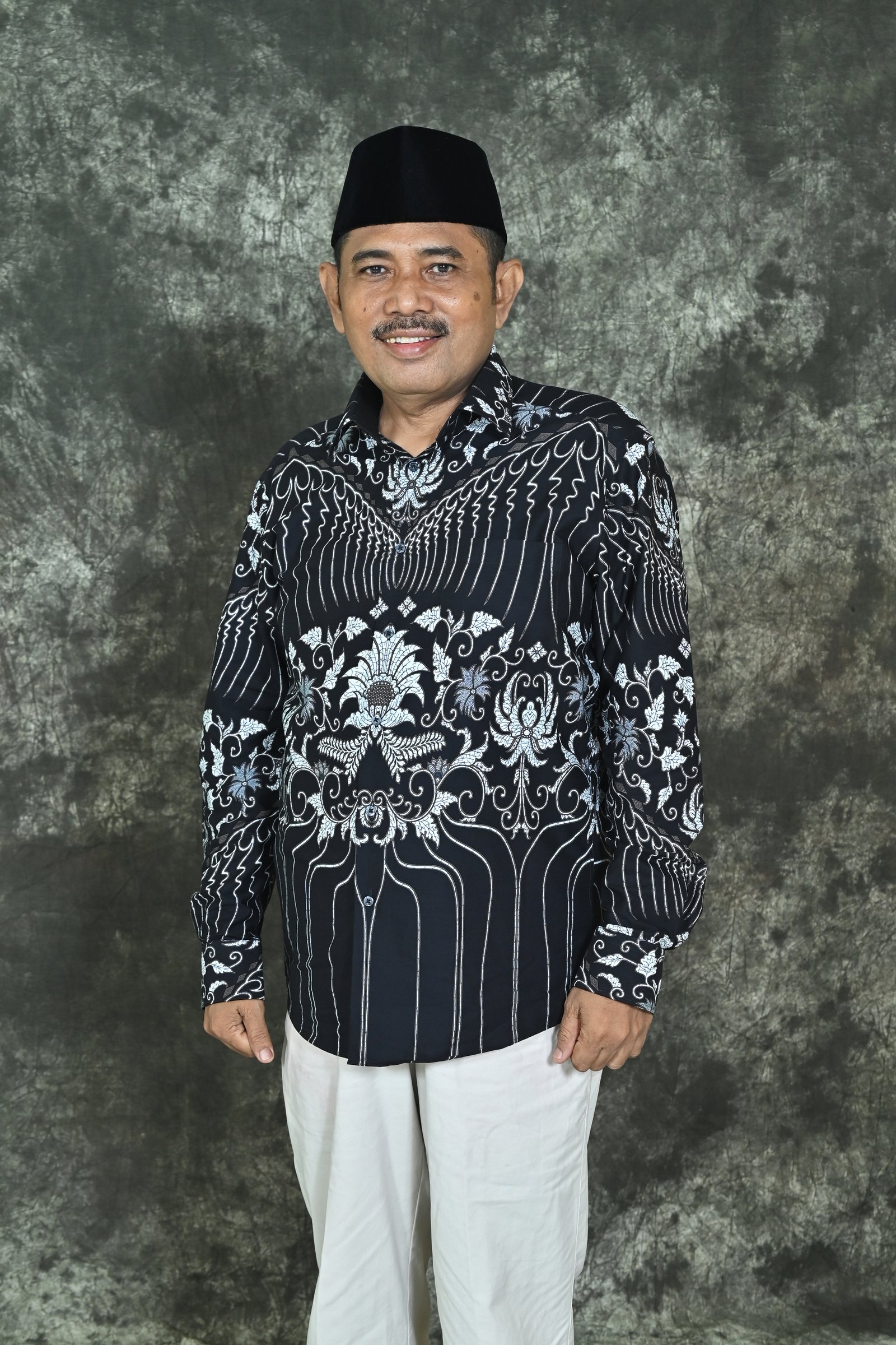 H. Yasmani, S.Pd., M.Pd.I.